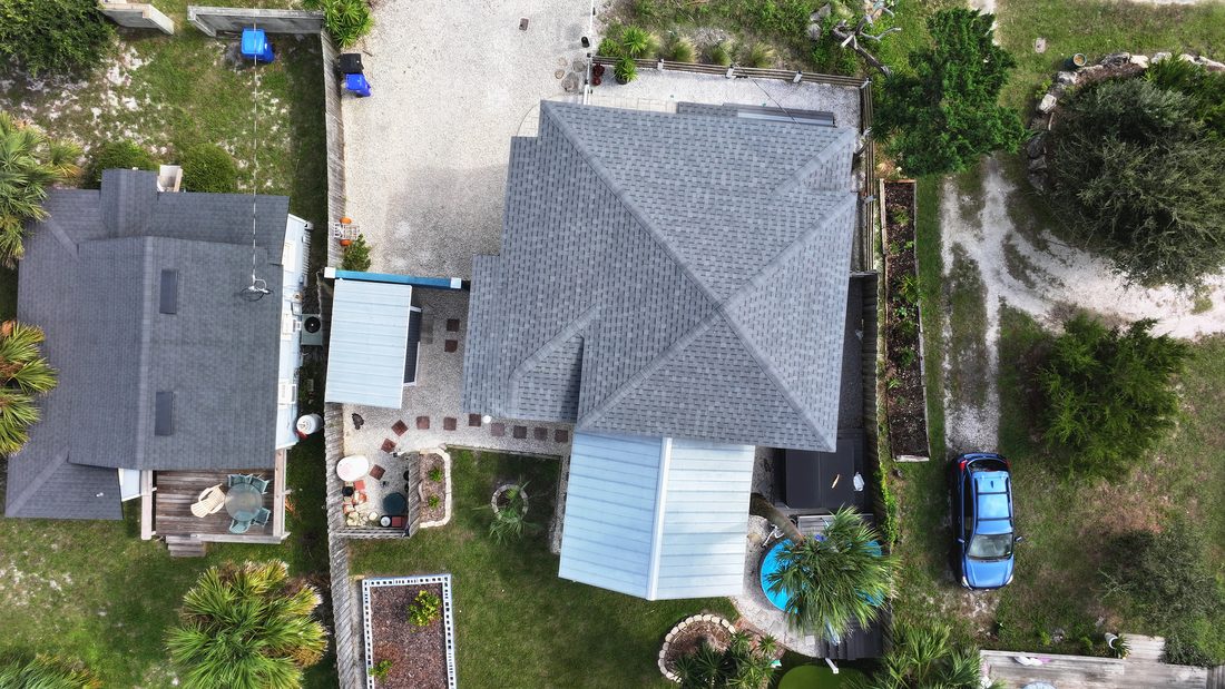Drone aerial view over a North Florida neighborhood and waterway, used to illustrate the Part 107 drone license course